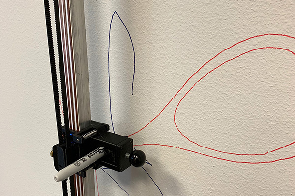 The mural drawing machine Botsy uses off-the-shelf markers and pens for the office large mural lettering.