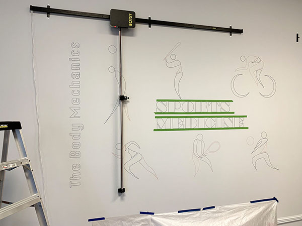 The upscaled office mural lettering after the drawing robot. The traced images are ready for hand painting.